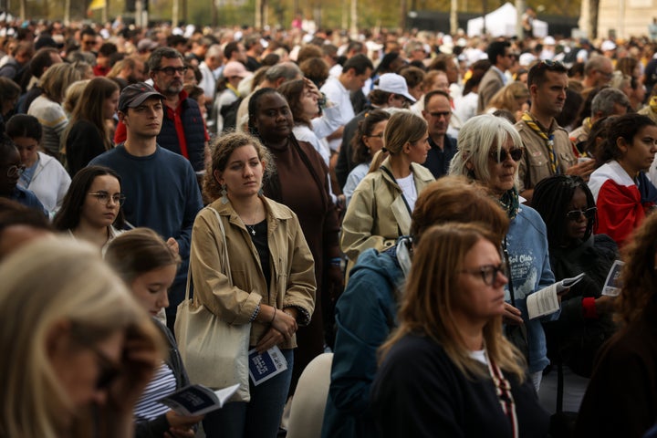 Faithful along on the Champs Elysees avenue follow a Mass celebrated by Pope Leo XIV at the Place de la Concorde in Paris, Saturday, Sept. 26, 2026. (AP Photo/Thomas Padilla)