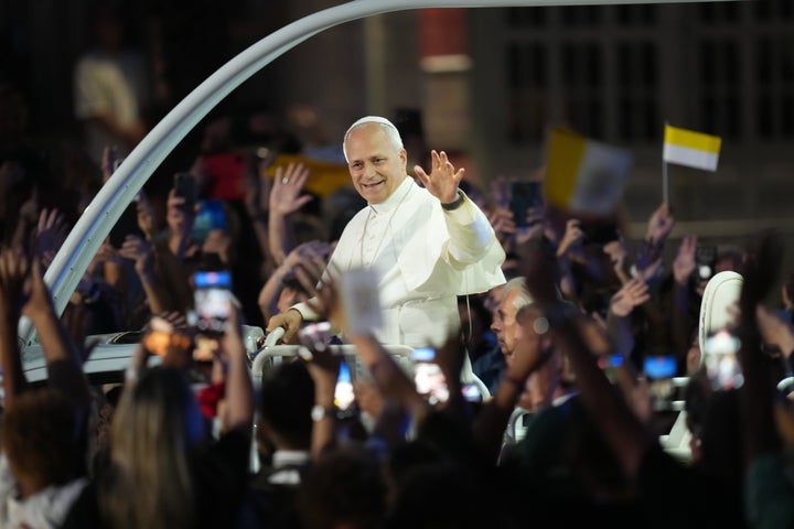 Pope Leo XIV waves to the crowd on his way for a prayer at the Grotto of the Apparitions of Massabielle, in Lourdes, France, Saturday, Sept. 26, 2026. (AP Photo/Thibault Camus)