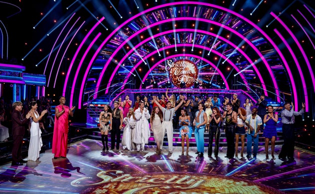Strictly hosts Josh Widdicombe, Emma Willis and Johannes Radebe pictured with the cast of 2026