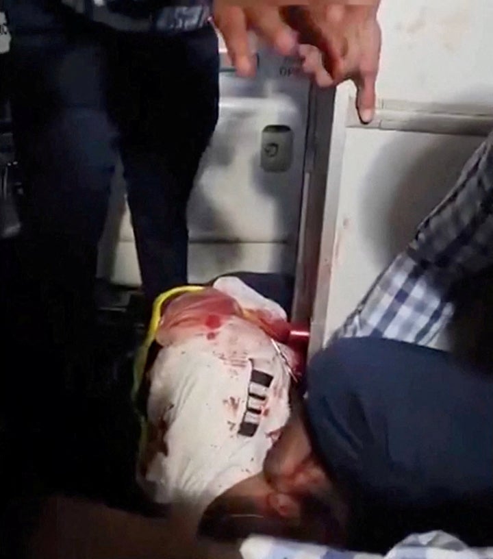 Passengers gather around an injured man aboard a Tel-Aviv-bound flydubai plane which was forced to land in Saudi Arabia after the pilots reportedly fought in the cockpit on Sept. 30, 2026.