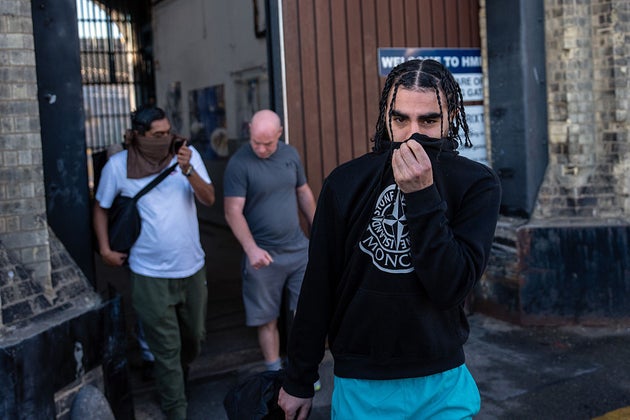Former inmates leave HMP Brixton.