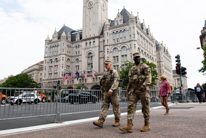 National Guard troops walk across the street from the Waldorf Astoria hotel in Washington in July. 