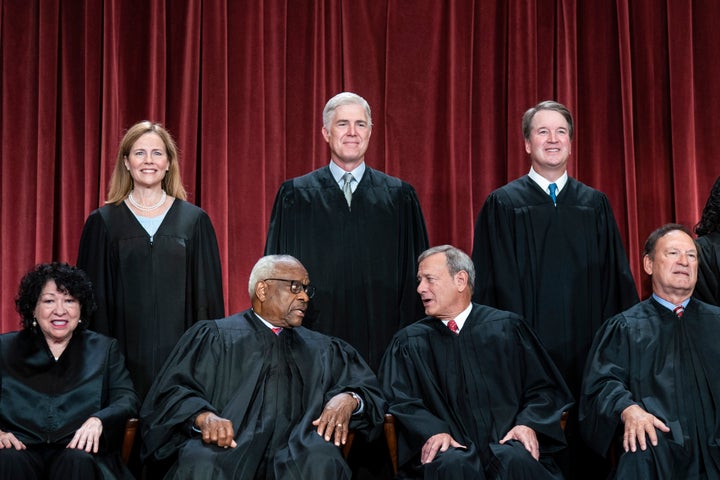 Members of the Supreme Court sit for a group photo in 2022. Top row, from left: Associate Justice Amy Coney Barrett, Associate Justice Neil Gorsuch, Associate Justice Brett Kavanaugh, and Associate Justice Ketanji Brown Jackson. Bottom row, from left: Associate Justice Sonia Sotomayor, Associate Justice Clarence Thomas, Chief Justice of the United States John Roberts, Associate Justice Samuel Alito, and Associate Justice Elena Kagan.