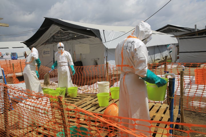 Health workers clean equipment inside a Ebola treatment camp in Butembo, Congo, on Sept. 30, 2026.