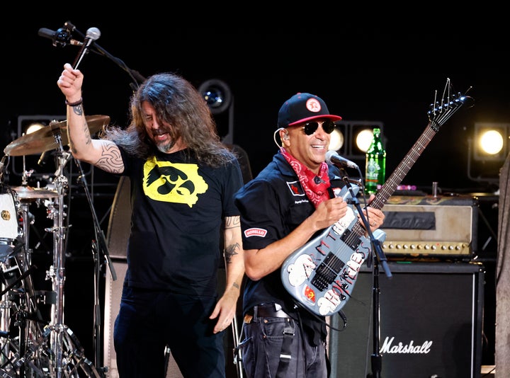 Foo Fighters' David Grohl (left) performs with Rage Against the Machine's Tom Morello wearing an Iowa Hawkeyes shirt at the Power To The People 2026 festival on Saturday.