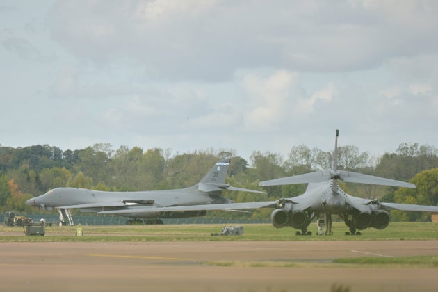 A B1 bomber is towed past another B1 aircraft at RAF Fairford.
