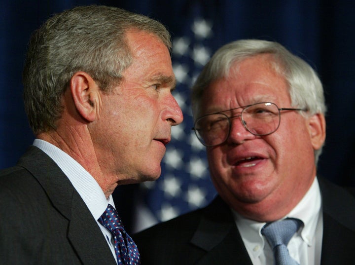 President George W. Bush, left, listens to House Speaker Dennis Hastert at a Bush-Cheney 2004 campaign fund-raising luncheon in Chicago.