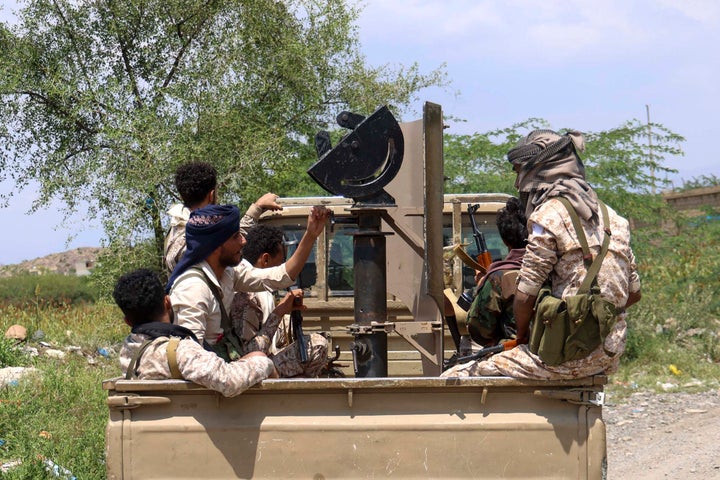 Saudi-backed Yemeni government forces ride in the back of a military truck at the Jabal Han front, west of the city of Taiz, following fierce battles earlier in the day as Houthi rebels reportedly attempted to seize control of the main route between the inland city of Taiz and the coastal city of Aden, on October 3, 2026.