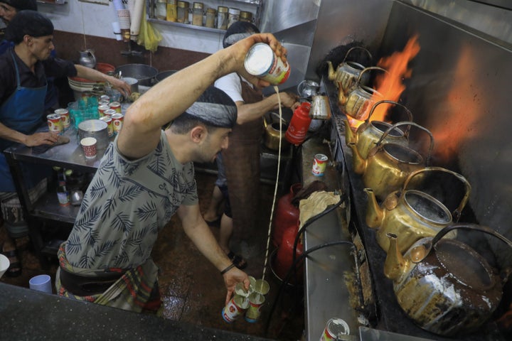 A tea seller pours milk from a can as he prepares tea at a market in Houthi-controlled Sanaa, Yemen, Monday, Sept. 28, 2026.