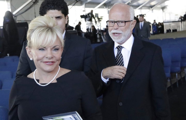 Televangelist Jim Bakker, right, walks with his second wife, Lori Beth Graham, in 2018.