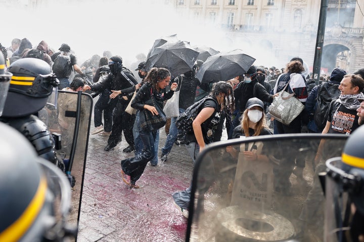 Riot police use water cannon as they face students during a protest against under-resourced schools, in Rennes, western France, on Oct. 6.
