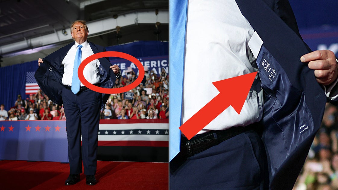 Donald Trump flashes the label of his JoS. A. Bank suit in Nebraska on Monday.