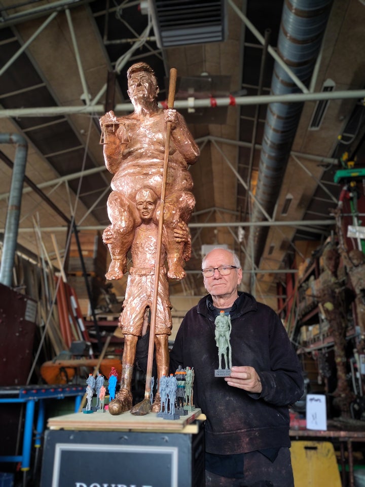 Galschiot and a version of his sculpture of Donald Trump, titled “The Orange Plague.”
