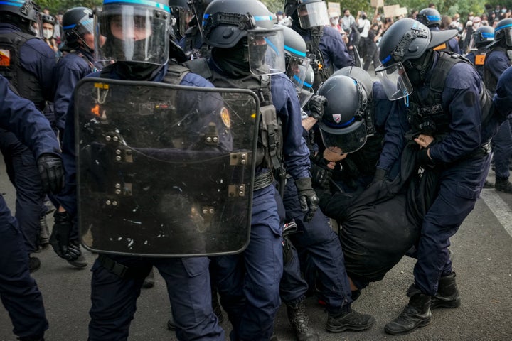 Police officers arrest a person as they disperse demonstrators at the end of a protest part of a nationwide day of actions called by high-school students, joined by unions and teachers, who for days have been demanding better learning conditions in protests punctuated by violent confrontations in Paris on Oct. 6, 2026. 