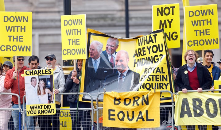 Anti-monarchy protestors are seen outside Westminster Abbey on March 9, in London, England. King Charles III stripped Mountbatten-Windsor of his princely title last year over his ties to the late sex offender Jeffrey Epstein.