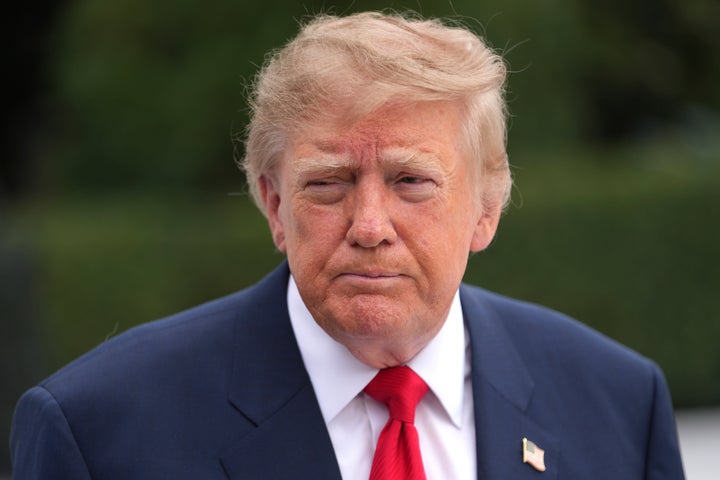 President Donald Trump speaks to members of the media before departing on Marine One from the South Lawn of the White House, Saturday, October 10, 2026, in Washington. (AP Photo/Nathan Howard)