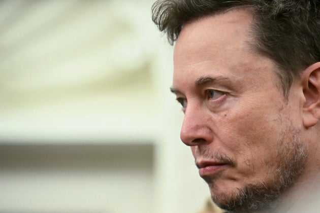 Co-leader of the Department of Government Efficiency Elon Musk looks on as US President Donald Trump meets with South African President Cyril Ramaphosa in the Oval Office of the White House in Washington, DC, on May 21, 2025. South African President Cyril Ramaphosa meets Donald Trump on Wednesday amid tensions over Washington's resettlement of white Afrikaners that the US president claims are the victims of 