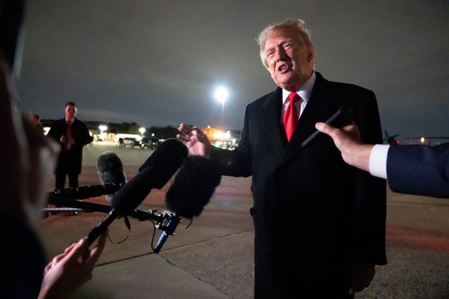 President Donald Trump speaks with reporters as he arrives on Air Force One, Saturday, Oct. 10, 2026, at Joint Base Andrews, Md.