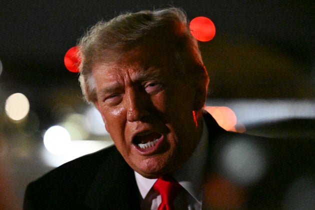 US President Donald Trump speaks to members of the press after landing on October 10, 2026 at Joint Base Andrews, Maryland. 