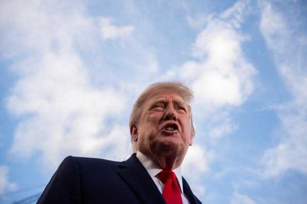 Donald Trump speaks to reporters before boarding Marine One on the South Lawn of the White House.