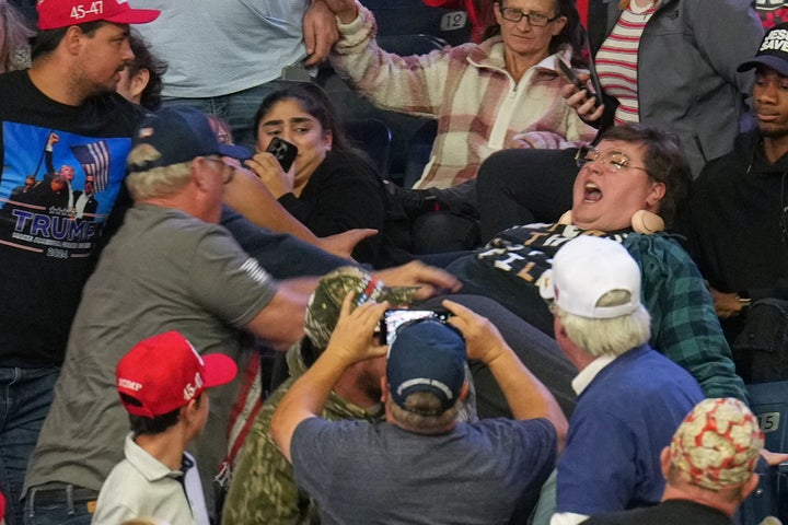 A protester shouts before being removed as President Donald Trump speaks during a campaign rally at the Covelli Center in Youngstown, Ohio.