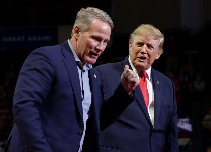 Trump shares the stage with Sen. Jon Husted (R-Ohio) at a rally in Ohio.