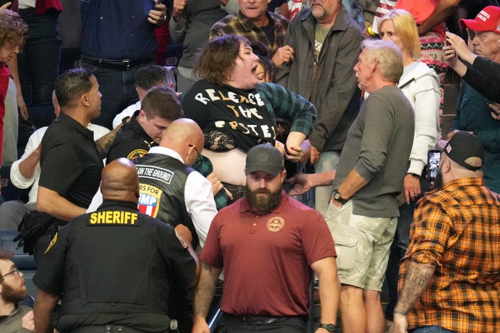 A protester yells before being removed as President Donald Trump speaks at a campaign rally at the Covelli Centre in Youngstown, Ohio, on Monday.