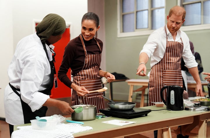 The couple cooks during a visit to the Himmah Hub, a food poverty community action group in Nottingham. Himmah tackles poverty, food insecurity, racism and social exclusion through community meals, food parcels and wider practical support. 