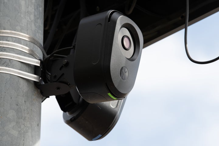 A close-up view shows the lens housing and camera unit of a solar-powered Flock Safety automated license plate reader in Santaquin, Utah.
