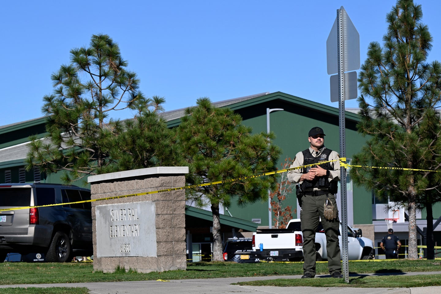 Police tape is placed outside Silver Rail Elementary school, where a shooting took place, on Thursday, Oct. 15, 2026 in Bend, Ore. (AP Photo/Joe Kline)