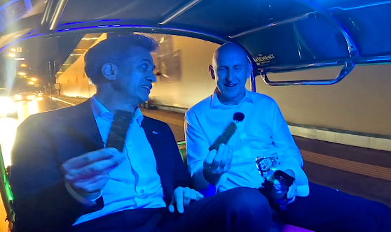 Ed Miliband and John Healey in the TukTuk