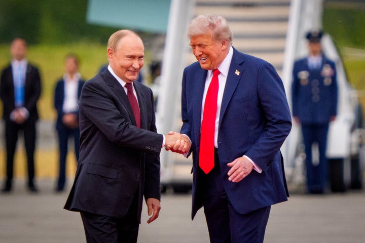 U.S. President Donald Trump greets Russian President Vladimir Putin as he arrives at Joint Base Elmendorf-Richardson on Aug. 15, 2025, in Anchorage, Alaska.