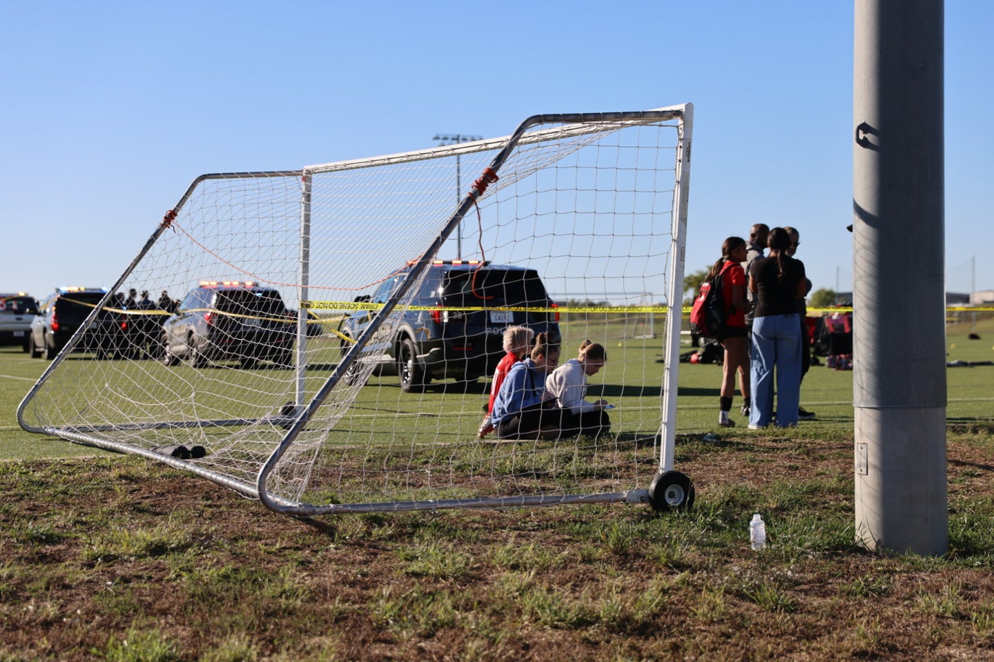 This image provided by KAKE shows police on the scene where a person drove a vehicle through a soccer field during a game in Wichita, Kansas, Saturday, Oct. 17,