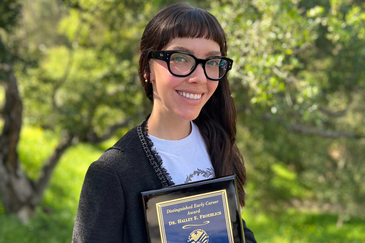 Halley Froehlich holding a U.S. Aquaculture Society award in Santa Barbara, Calif., on Feb. 27, 2026. (Halley Froehlich via AP)