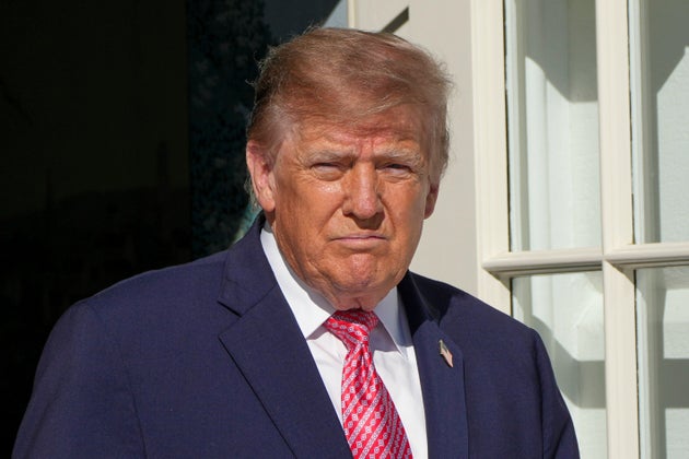 President Donald Trump walks to speak with reporters before departing on Marine One from the South Lawn of the White House, Monday, Oct. 19, 2026, in Washington. 