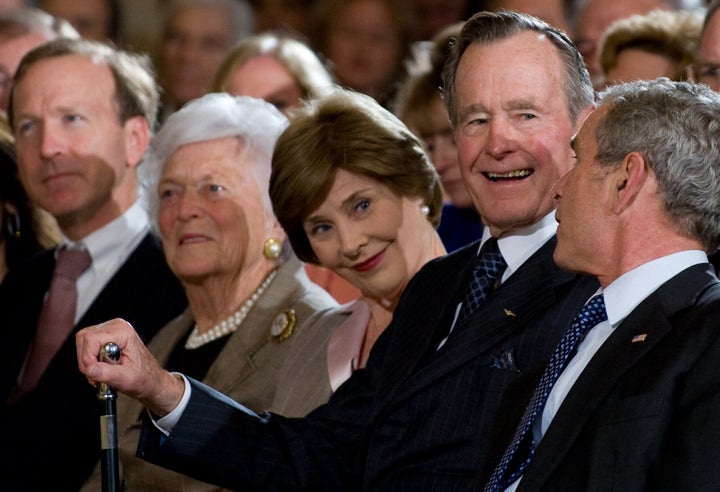  Neil Bush, former first lady Barbara Bush, former first lady Laura Bush, former President George H.W. Bush, and then-President George W. Bush attend a reception in honor of the Points of Light Institute at the White House on Jan. 7, 2009.