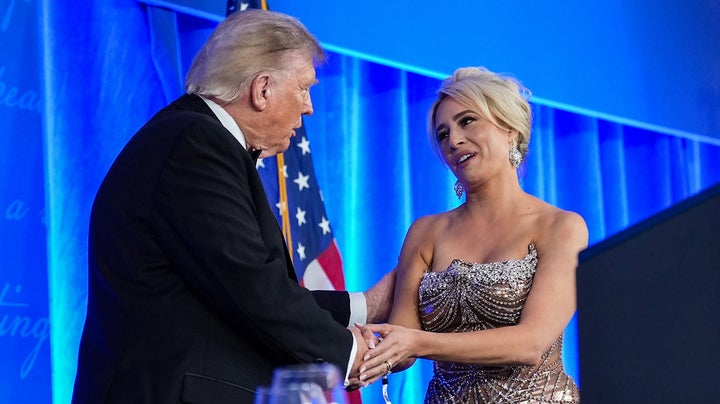 Donald Trump, pictured greeting Jacqui Heinrich at the rescheduled White House Correspondents Dinner in July, got a rebuke from Heinrich and the press organization on Wednesday.