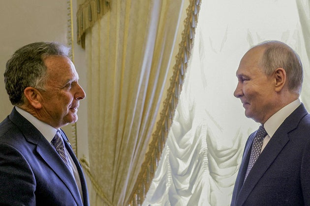 Vladimir Putin greets US special envoy Steve Witkoff during their meeting in Saint Petersburg.