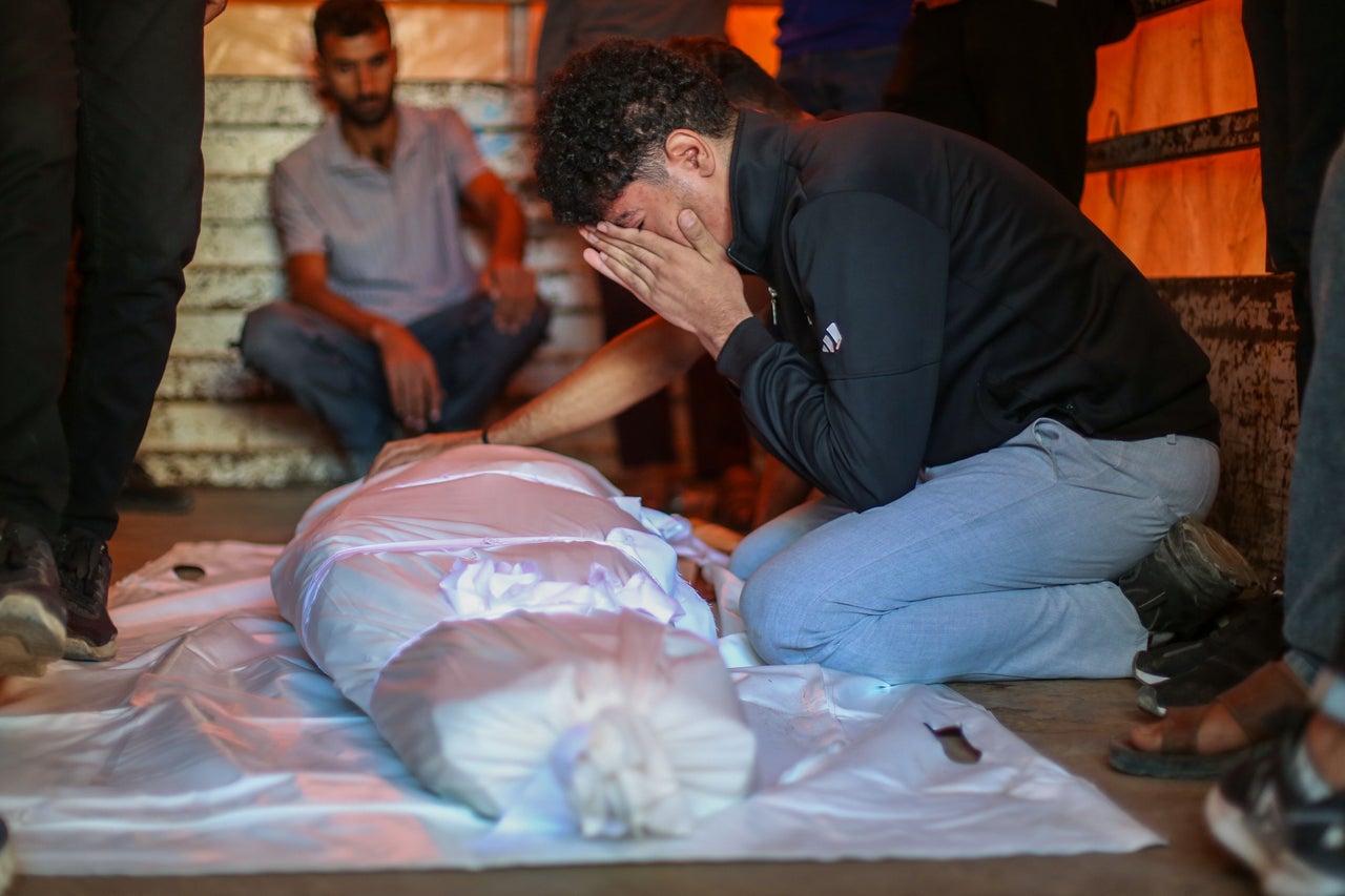 Relatives mourn victims of an airstrike at Al-Shifa Hospital on Oct. 22, 2026, in Gaza City, Gaza. 