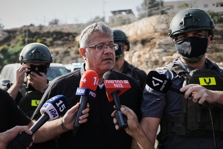 Israeli National Security Minister Itamar Ben-Gvir speaks to the media at the scene of a shooting attack carried out by Palestinian gunmen at a junction near Hebron in the occupied West Bank on Oct. 23, 2026.