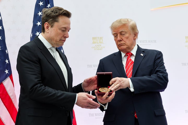 Tesla and SpaceX CEO Elon Musk (L) receives the National Medal of Science from U.S. President Donald Trump during the Golden Age of American Innovation Summit at the Institute of Peace on October 08, 2026 in Washington, DC. Trump awarded some of the nation's highest scientific honors to technology leaders including Elon Musk, Sergey Brin, Jensen Huang, Lisa Su, Michael Dell, and Satya Nadella. (Photo by Win McNamee/Getty Images)