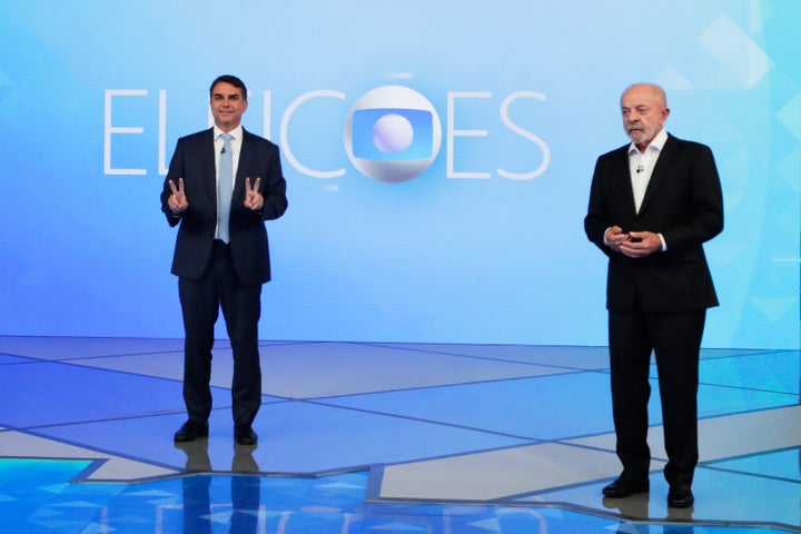 Brazilian President Luiz Inacio Lula da Silva, right, who is running for reelection, and opposition presidential candidate Sen. Flavio Bolsonaro attend a televised presidential debate days before the presidential runoff election in Rio de Janeiro, Friday, Oct. 23, 2026. (AP Photo/Bruna Prado)