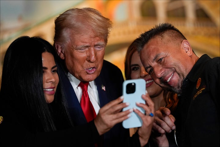 Donald Trump poses for a photo at a campaign event at ll Toro E La Capra restaurant with owner Javier Barajas (right) in August 2024.
