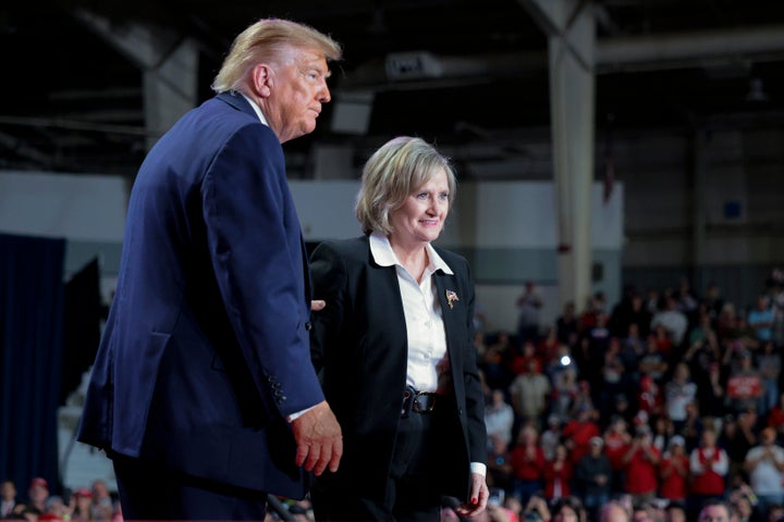 President Donald Trump embraces Sen. Cindy Hyde-Smith (R-Miss.) during a campaign rally Monday in Corinth, Mississippi. 