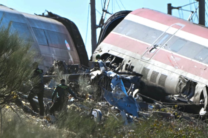 Civil Guards stand amongst the wreckage of train collision between a high speed Renfe AVE train and an Iryo train between Urda and Los Yebenes in the province of Toledo, on Oct. 28, 2026.