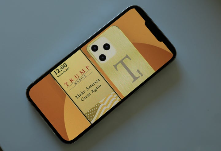 In this photo illustration, an iPhone displays the website for Trump Mobile and a Trump-branded smartphone.